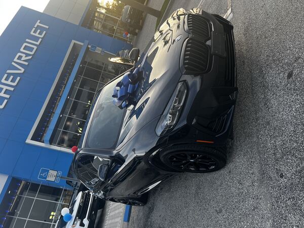 Black 2023 BMW X3 xDrive30i M Sport with delivery ribbon — DealDrvn client deal negotiated near wholesale pricing